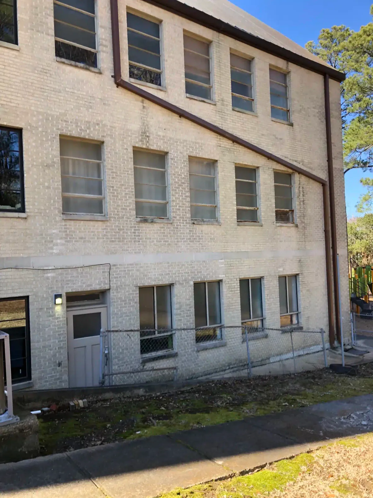 Before: brick church building with old windows